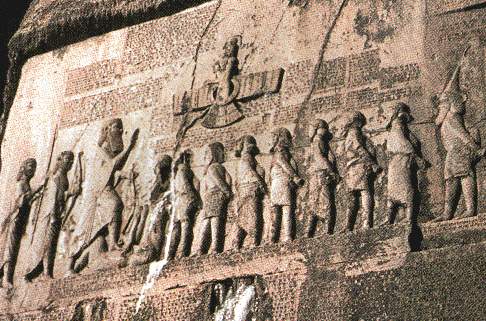 52 - giant King Darius with captives, & Ashur above giving protection